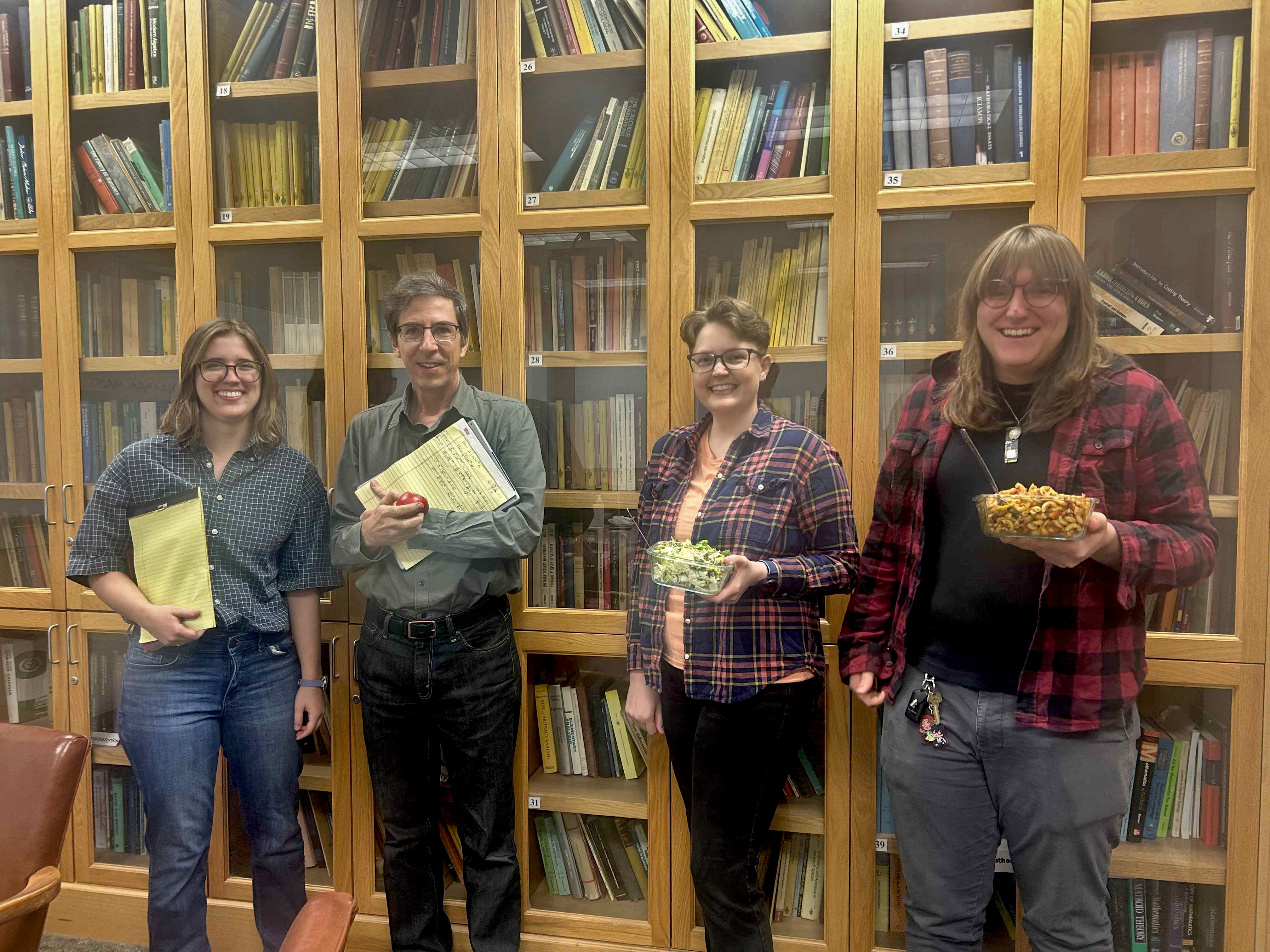 A photo of Kurtz dressed as Shipman and Garcia dressed as Bibby, all four pictured smiling.