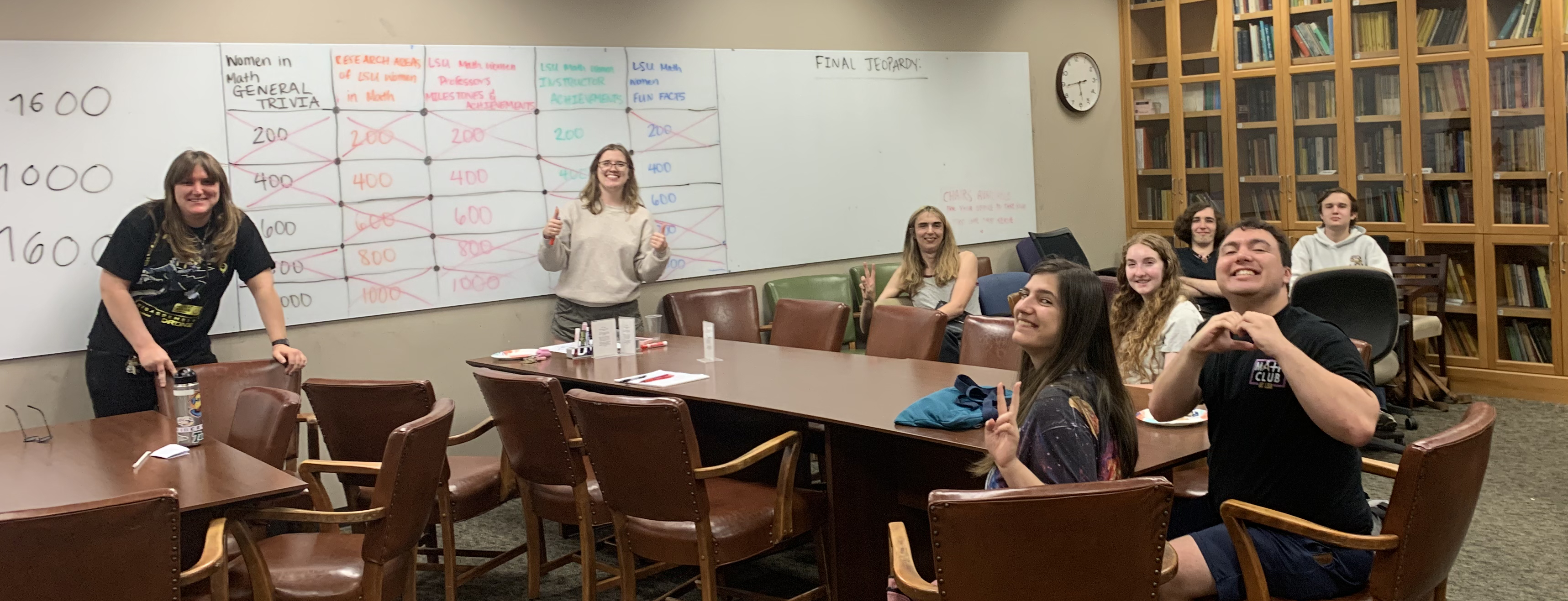 AWM and Math Club members smile while competing in a game of trivia!