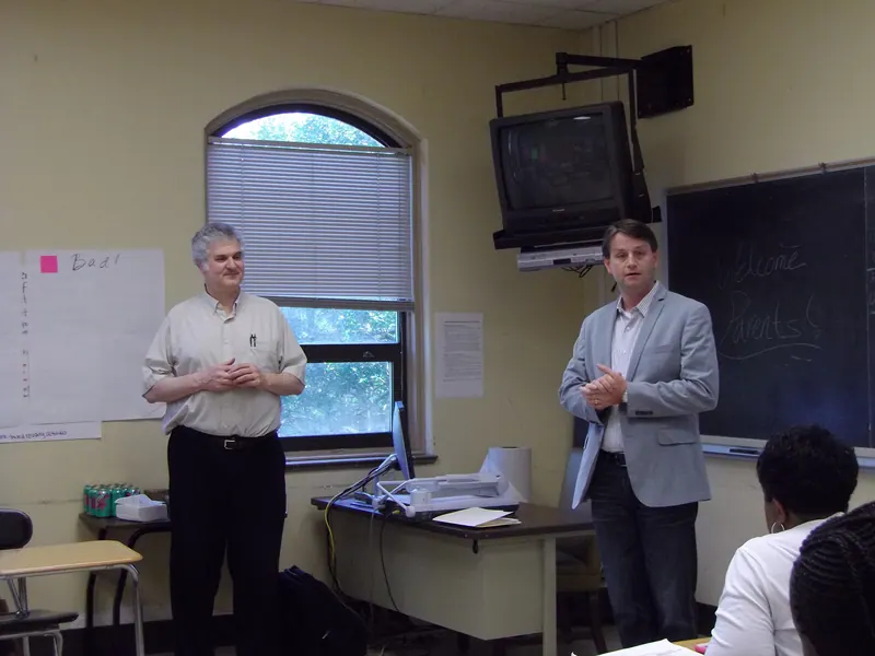 Two volunteers answer questions from the participants.