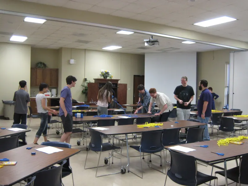 Volunteers set up tables.
